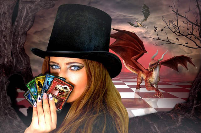 young woman in top hat with Magic cards, game board and dragon in background