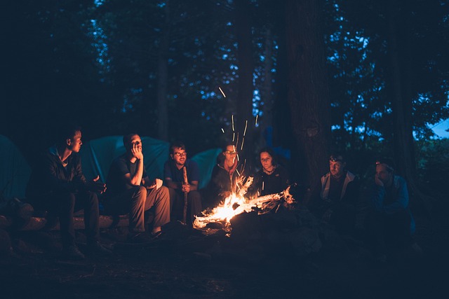 a group of friends around a campfire