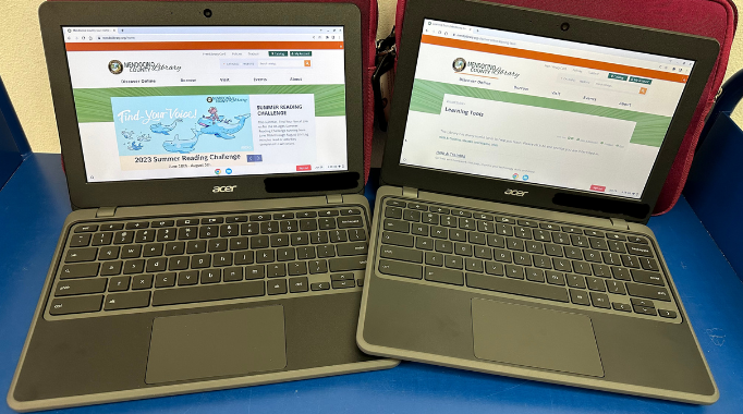 photo of two open Chromebook laptops