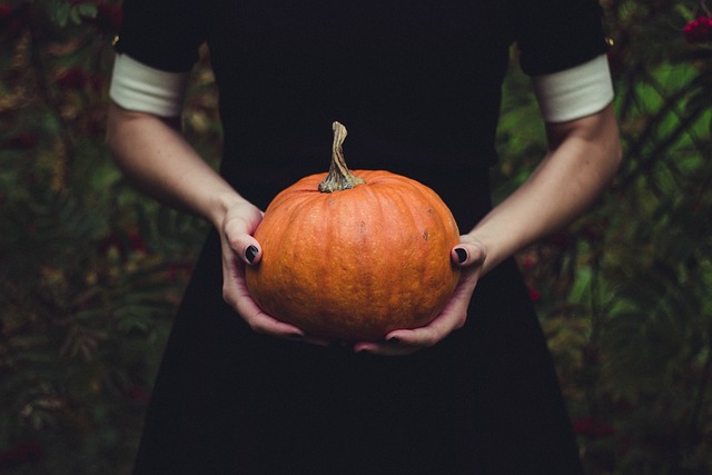 woman holding pumpkin