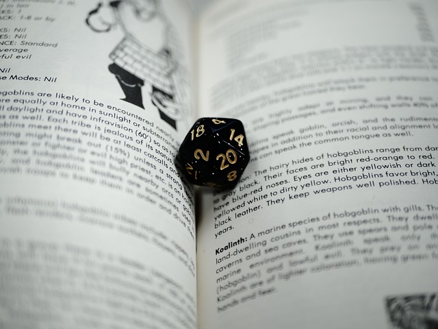 Image of multi-sided dice and open book.