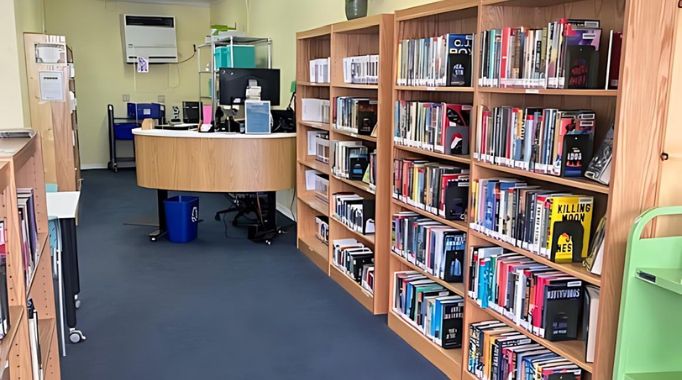 Bookshelves and front desk.