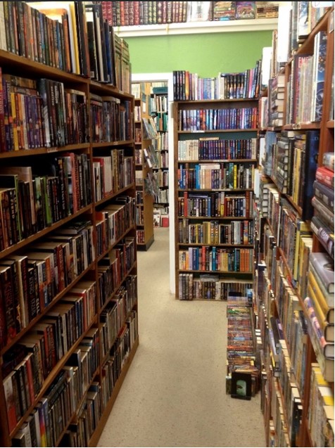 hallway with many bookshelves.